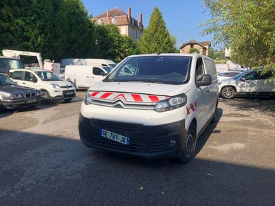 a white van that is parked in a parking lot