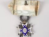 l'image d'une médaille portant une étoile