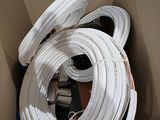 a box with a bunch of white hoses inside of it