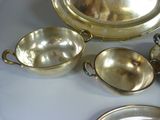 a silver plate with a silver bowl and a silver plate with a silver plate