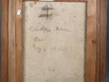 an old picture of a wooden frame with writing on it