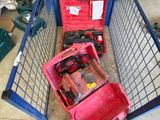 a red box with tools inside of it on the floor