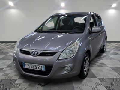 a picture of a silver car parked in a garage