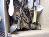 a box full of silver spoons and spoons in it