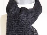 a close up of a black scarf on a mannequin