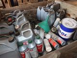 a wooden box filled with various cans and cans