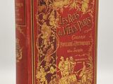 un livre rouge et doré orné d'illustrations dorées