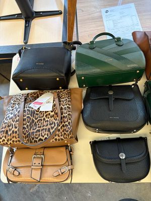 a lot of bags that are sitting on a table