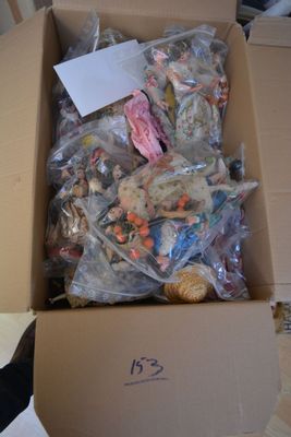 a cardboard box filled with lots of different types of toys