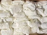 a cardboard box filled with lots of white items