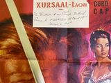 a poster for a movie starring a woman in a blue dress