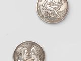 two silver coins, one with the head of a man and one with a woman