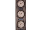 three clocks mounted on a wall with a chalk board underneath them