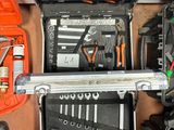 many tools in a tool case on the floor