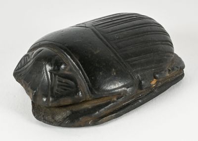 an image of a statue of a scarabus on a white surface