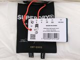 a tag on a pillow that says superdrys