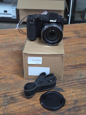 a camera sitting on top of a box on a table
