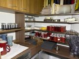 a kitchen with a lot of items on the shelves