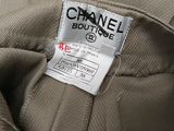 the label on the back of a chanel coat is clearly visible