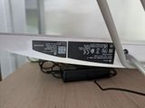 an image of a computer desk with a laptop on top of it