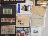 a collection of stamps and postcards on display in a case