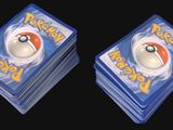two plastic coasters with a picture of a pokemon ball on top of them