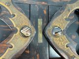 two pairs of scissors sitting on top of a wooden shelf