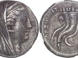 a close up of a coin with a woman ' s face on it