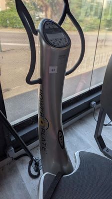 a machine that is sitting on the floor in front of a window