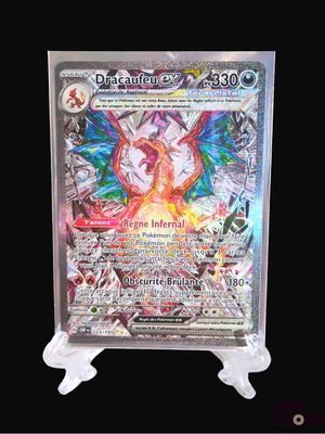a close up of a pokemon card on a stand