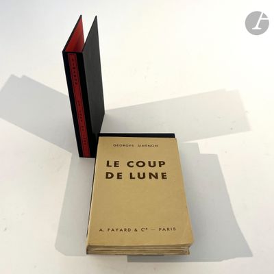 a stack of books sitting on a table next to each other