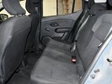 the back seats of a car with a remote control in it