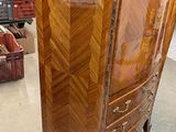 a tall wooden cabinet in the middle of a store