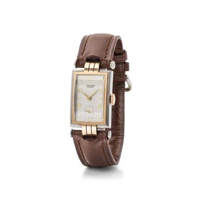 Gros plan sur une montre-bracelet avec un bracelet marron