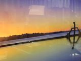 a picture of a reflection of a sunset in a window