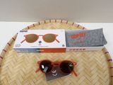 a pair of sunglasses and a pair of socks on a tray
