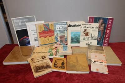 several books on a red table with a red table cloth