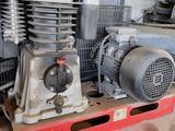 a small air compressor sitting on top of a table