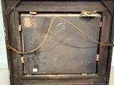 a picture of an old wooden frame with a rope hanging from it