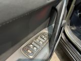 a close up of a car door with a remote control