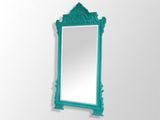 an image of a mirror hanging on a wall in a room