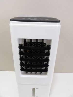 a black and white air purifier sitting on a table