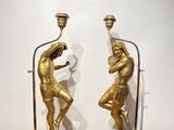 pair of antique brass figurines of a man and a woman