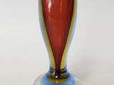 a glass vase that is sitting on a table