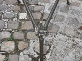 a bicycle that is sitting on a stand on the ground