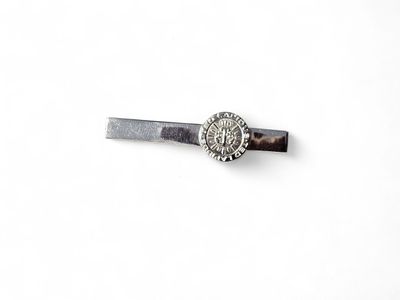a picture of a tie bar that has a picture of a man on it
