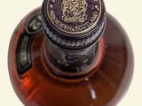 a close up of a bottle of alcohol on a table