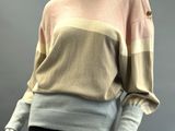 an image of a mannequin mannequin wearing a sweater and skirt