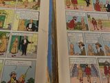 two pages of comics that are open on a table