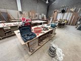 a picture of a workbench in a building with tools on it